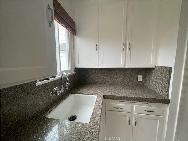 2221 Granada Ave, Long Beach, CA 90815 - kitchen featuring a sink, white cabinets, and tasteful backsplash