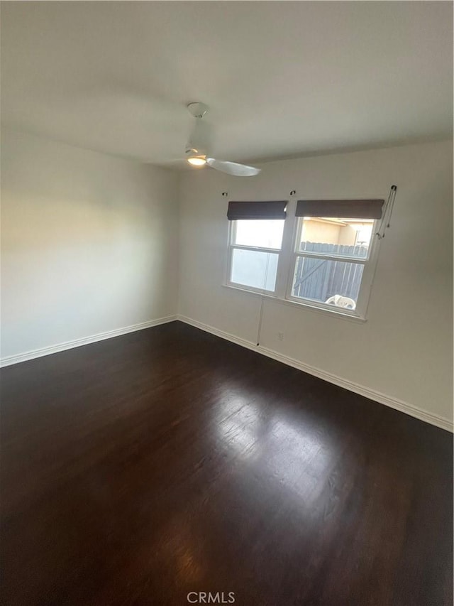 2221 Granada Ave, Long Beach, CA 90815 - unfurnished room with dark wood finished floors, baseboards, and ceiling fan