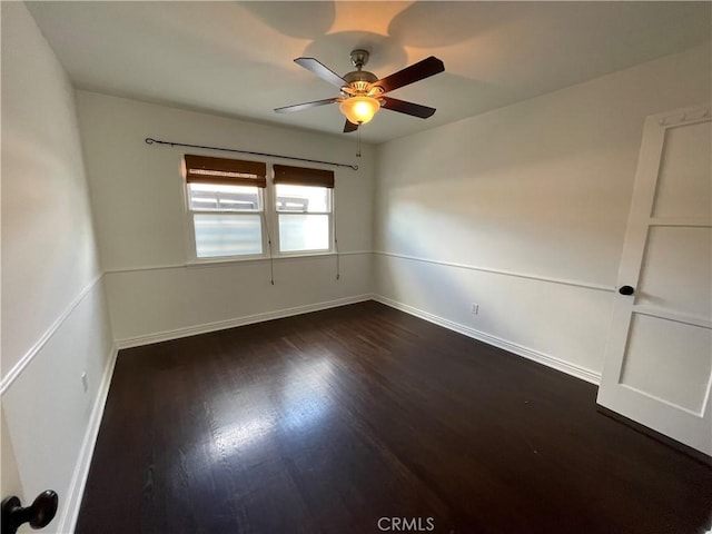 2221 Granada Ave, Long Beach, CA 90815 - unfurnished room featuring a ceiling fan, dark wood finished floors, and baseboards