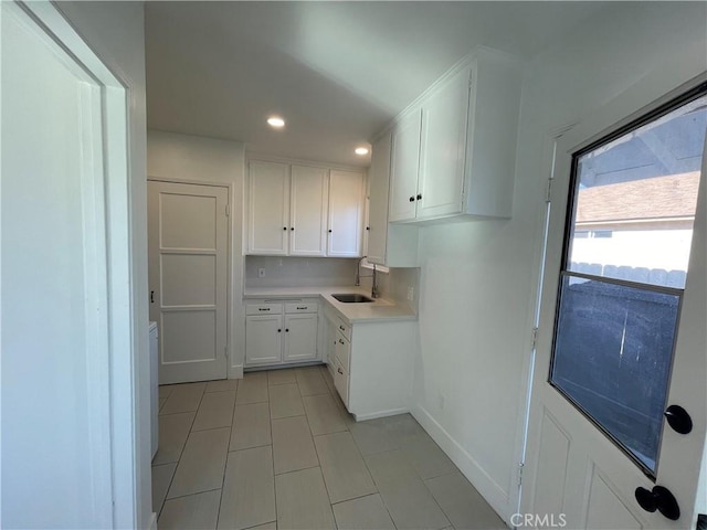 2221 Granada Ave, Long Beach, CA 90815 - kitchen featuring light tile patterned flooring, a sink, white cabinets, light countertops, and recessed lighting