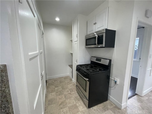 2221 Granada Ave, Long Beach, CA 90815 - kitchen with stainless steel appliances, white cabinets, baseboards, and recessed lighting