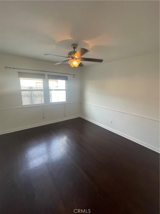2221 Granada Ave, Long Beach, CA 90815 - spare room featuring baseboards, dark wood-type flooring, and a ceiling fan