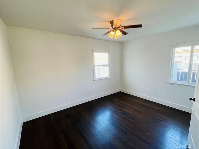 2221 Granada Ave, Long Beach, CA 90815 - empty room with dark wood-style floors, baseboards, and ceiling fan