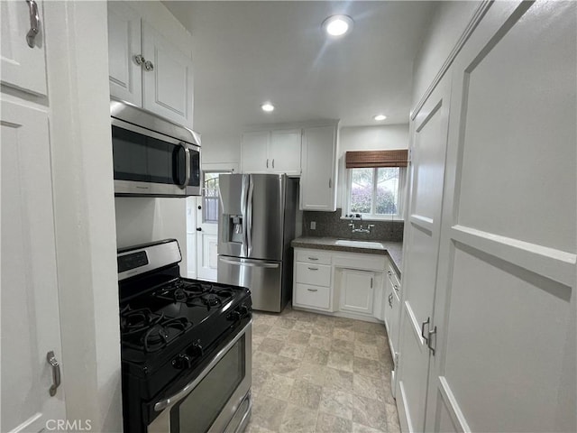 2221 Granada Ave, Long Beach, CA 90815 - kitchen featuring stainless steel appliances, recessed lighting, white cabinetry, a sink, and backsplash