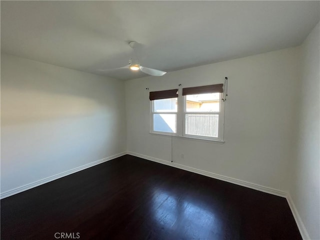 2221 Granada Ave, Long Beach, CA 90815 - unfurnished room with baseboards, dark wood-style flooring, and a ceiling fan