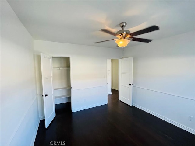 2221 Granada Ave, Long Beach, CA 90815 - unfurnished bedroom featuring dark wood-type flooring, baseboards, a closet, and ceiling fan