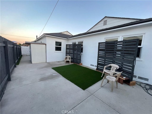 2221 Granada Ave, Long Beach, CA 90815 - back of house with a fenced backyard, a patio, and stucco siding