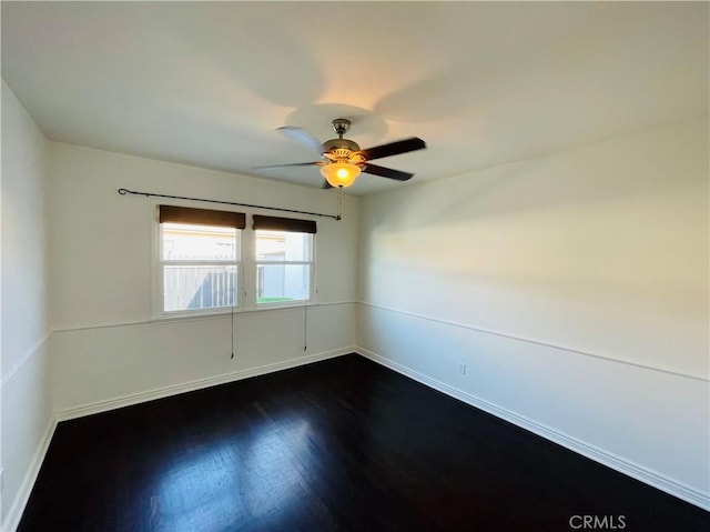 2221 Granada Ave, Long Beach, CA 90815 - empty room featuring baseboards, dark wood-style floors, and a ceiling fan