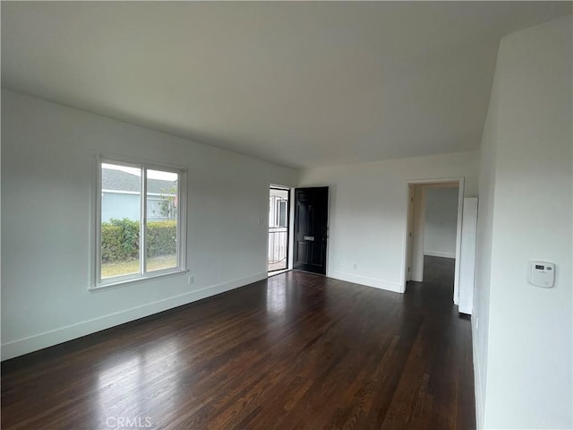 2221 Granada Ave, Long Beach, CA 90815 - empty room with baseboards and dark wood-style flooring