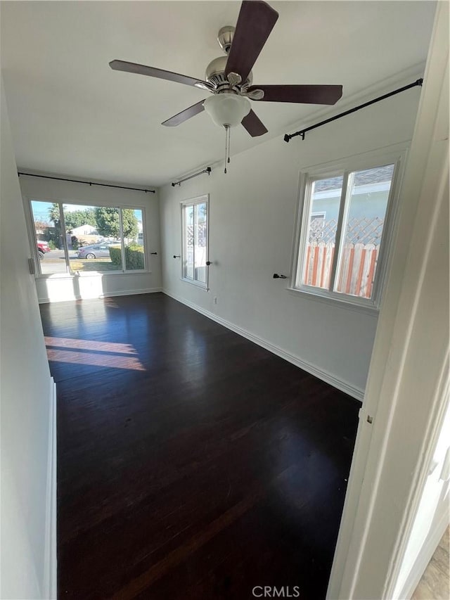 2221 Granada Ave, Long Beach, CA 90815 - empty room featuring wood finished floors, baseboards, and ceiling fan