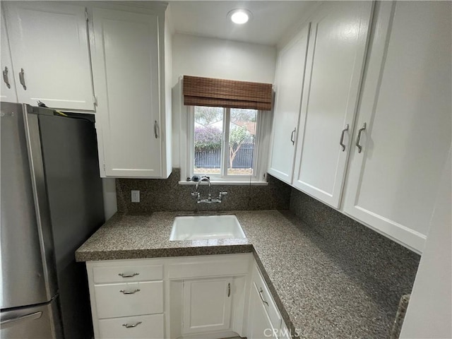 2221 Granada Ave, Long Beach, CA 90815 - kitchen featuring freestanding refrigerator, a sink, white cabinets, and recessed lighting