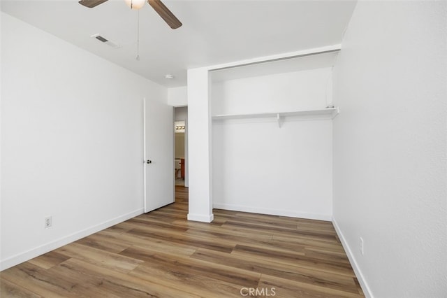 41586 Zinfandel Ave, Temecula, CA 92591 - unfurnished bedroom featuring wood finished floors, baseboards, a closet, and a ceiling fan