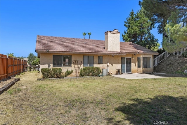 41586 Zinfandel Ave, Temecula, CA 92591 - back of property with a chimney, stucco siding, a patio, a tile roof, and central AC