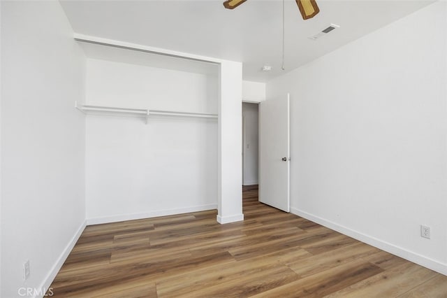 41586 Zinfandel Ave, Temecula, CA 92591 - unfurnished bedroom featuring wood finished floors, baseboards, ceiling fan, and a closet