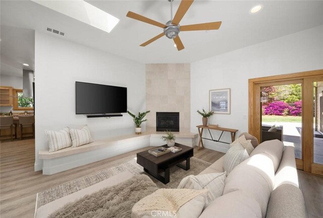 313 Myrtle Dr, Arroyo Grande, CA 93420 - living area with wood finished floors, ceiling fan, a skylight, recessed lighting, and a fireplace