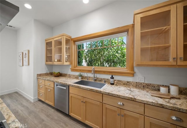 313 Myrtle Dr, Arroyo Grande, CA 93420 - kitchen featuring dishwasher, a sink, light wood-style flooring, light stone counters, and baseboards