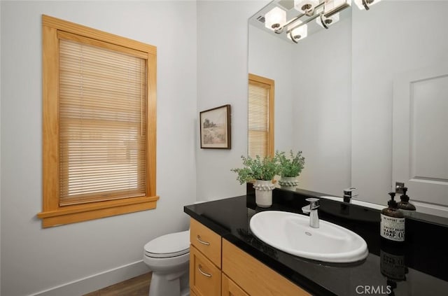 313 Myrtle Dr, Arroyo Grande, CA 93420 - bathroom with vanity, toilet, baseboards, wood finished floors, and a chandelier