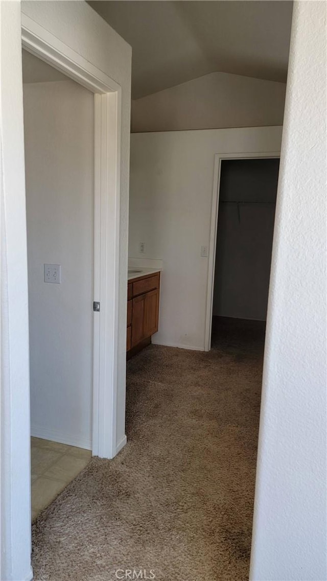 241 Exeter Way, Corona, CA 92882 - corridor with carpet floors and vaulted ceiling