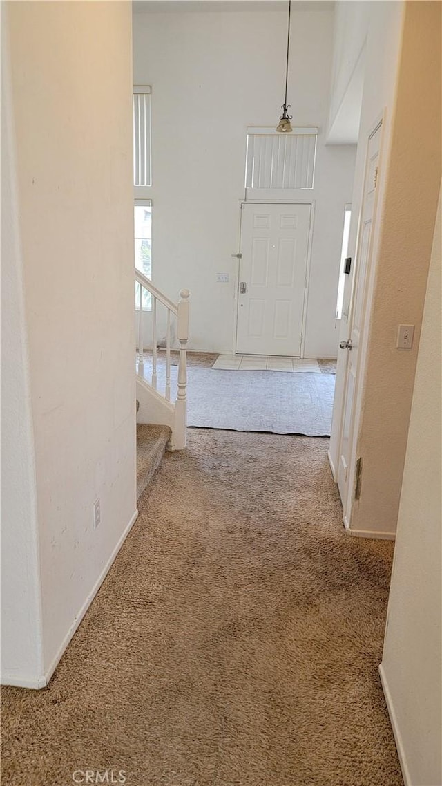 241 Exeter Way, Corona, CA 92882 - hall with carpet floors, stairway, and baseboards