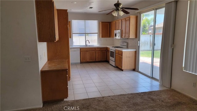 241 Exeter Way, Corona, CA 92882 - kitchen featuring white appliances, plenty of natural light, ceiling fan, and light countertops