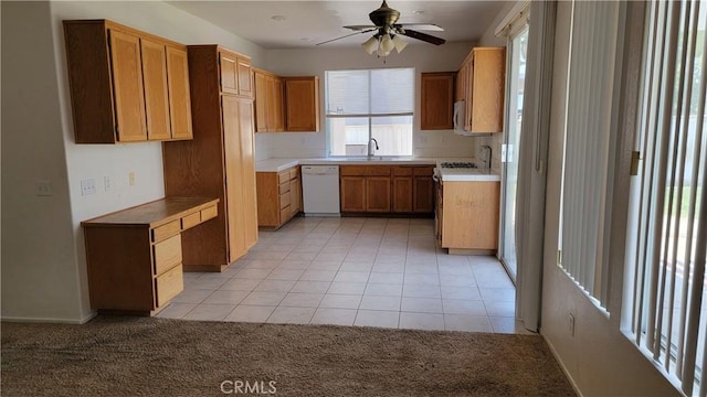 241 Exeter Way, Corona, CA 92882 - kitchen with white appliances, a ceiling fan, light carpet, light tile patterned floors, and light countertops