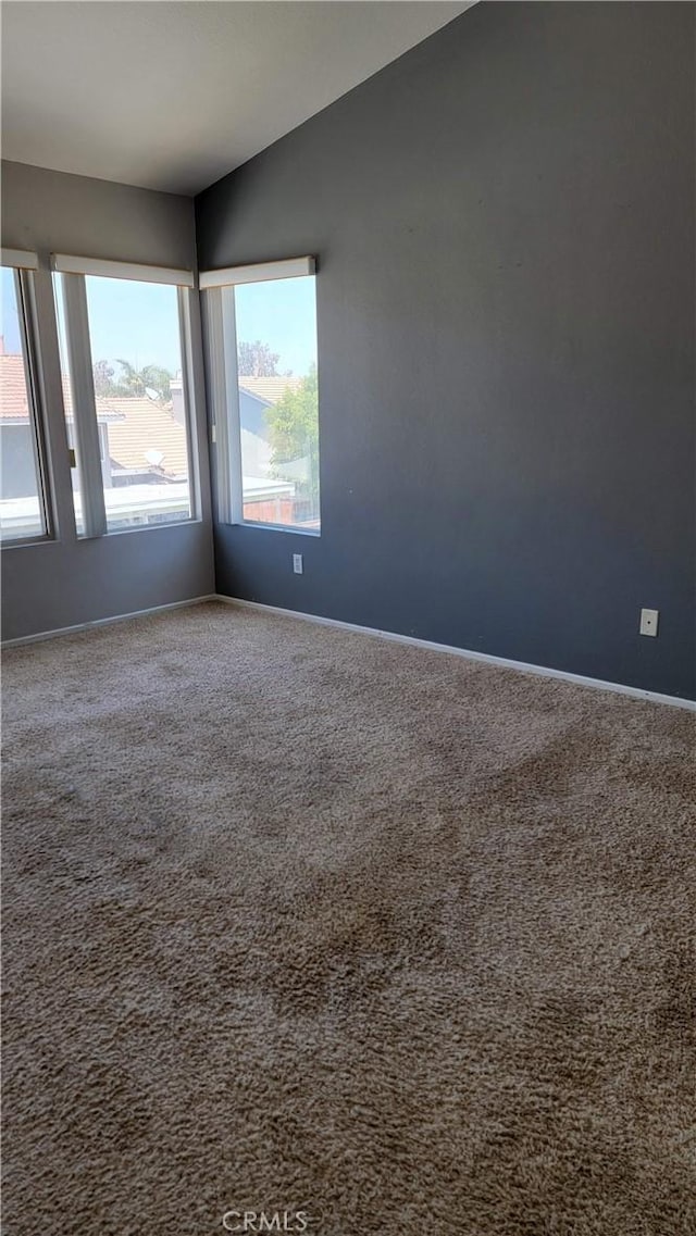 241 Exeter Way, Corona, CA 92882 - unfurnished room with carpet floors, baseboards, and vaulted ceiling