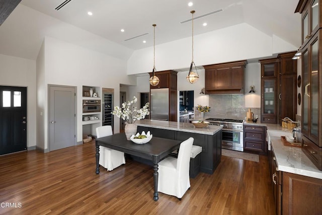 2384 E Orange Grove Blvd, Pasadena, CA 91104 - kitchen with high end appliances, a sink, a center island, dark wood-style floors, and high vaulted ceiling