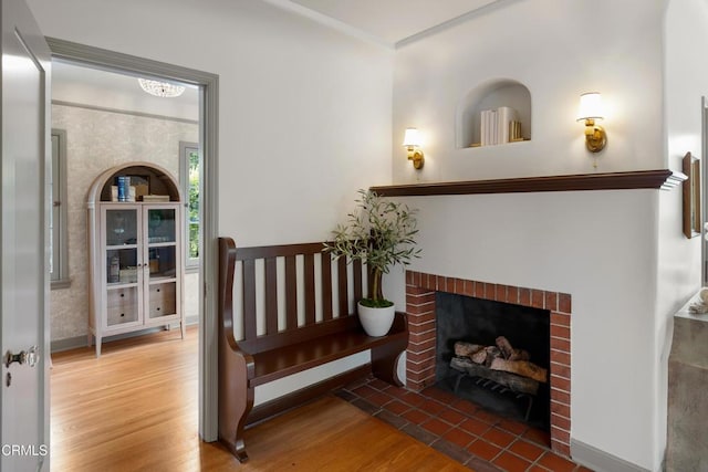 2384 E Orange Grove Blvd, Pasadena, CA 91104 - living area with wood finished floors, a fireplace, and crown molding