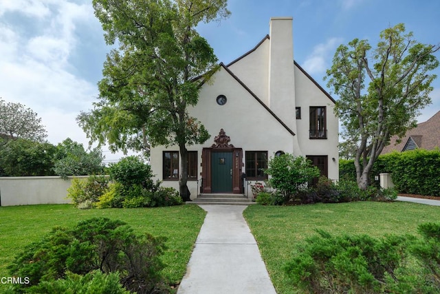2384 E Orange Grove Blvd, Pasadena, CA 91104 - view of front of property featuring a front yard, stucco siding, and a chimney
