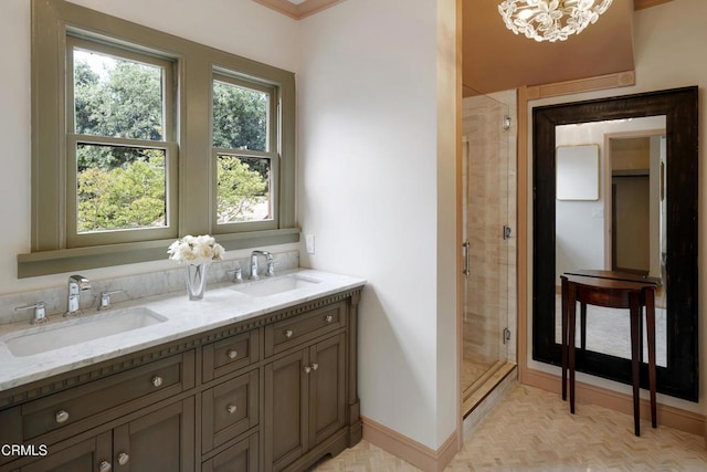 2384 E Orange Grove Blvd, Pasadena, CA 91104 - bathroom with a shower stall, double vanity, a chandelier, and baseboards