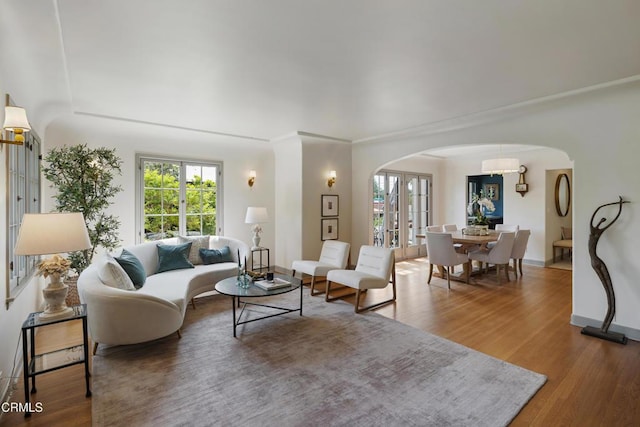 2384 E Orange Grove Blvd, Pasadena, CA 91104 - living area with arched walkways, plenty of natural light, and wood finished floors