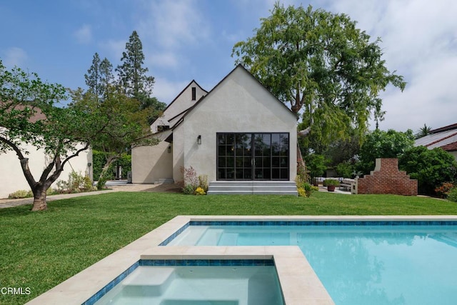2384 E Orange Grove Blvd, Pasadena, CA 91104 - back of property featuring an in-ground hot tub, a lawn, stucco siding, and an outdoor pool