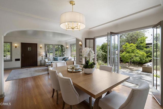 2384 E Orange Grove Blvd, Pasadena, CA 91104 - dining space with arched walkways and wood finished floors