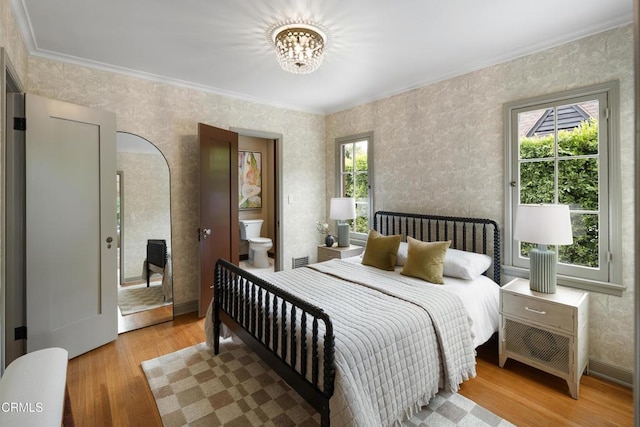 2384 E Orange Grove Blvd, Pasadena, CA 91104 - bedroom with ornamental molding, light wood-style flooring, a chandelier, and wallpapered walls