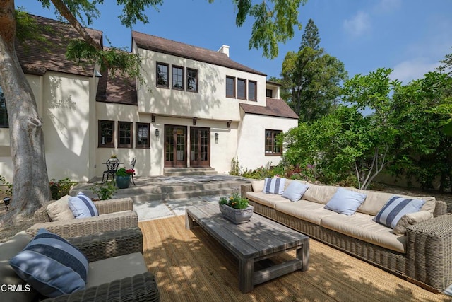 2384 E Orange Grove Blvd, Pasadena, CA 91104 - back of property with stucco siding, an outdoor hangout area, a wooden deck, and french doors
