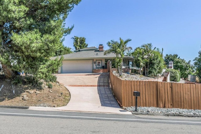1923 Hidden Mesa Rd, El Cajon, CA 92019 - view of front of house with a fenced front yard, driveway, and a garage