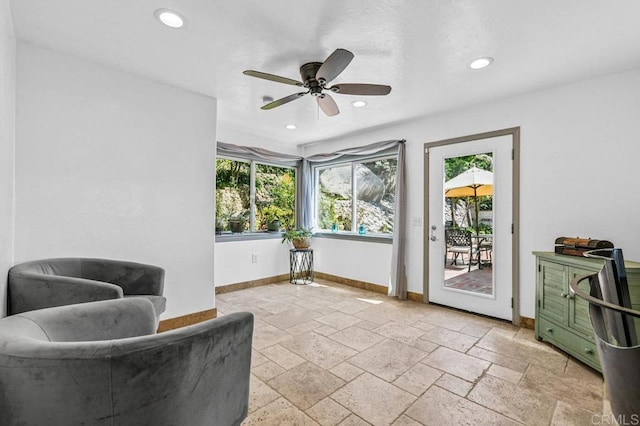 1923 Hidden Mesa Rd, El Cajon, CA 92019 - sitting room with healthy amount of natural light, ceiling fan, baseboards, stone tile floors, and recessed lighting
