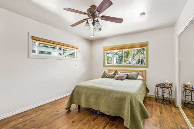 1923 Hidden Mesa Rd, El Cajon, CA 92019 - bedroom featuring multiple windows, wood finished floors, baseboards, and a ceiling fan