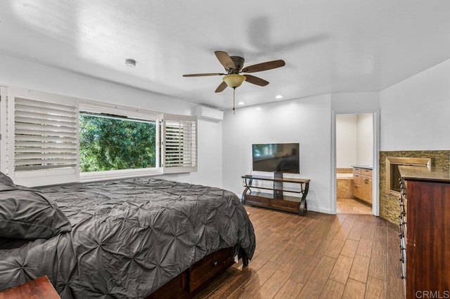 1923 Hidden Mesa Rd, El Cajon, CA 92019 - bedroom featuring a wall unit AC, dark wood finished floors, baseboards, connected bathroom, and recessed lighting