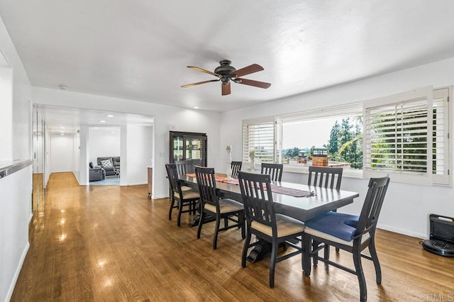 1923 Hidden Mesa Rd, El Cajon, CA 92019 - dining area featuring a ceiling fan, wood finished floors, and baseboards