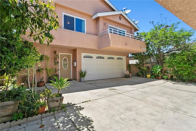 11889 Gale Ave, Hawthorne, CA 90250 - view of front of home with stucco siding, driveway, and an attached garage