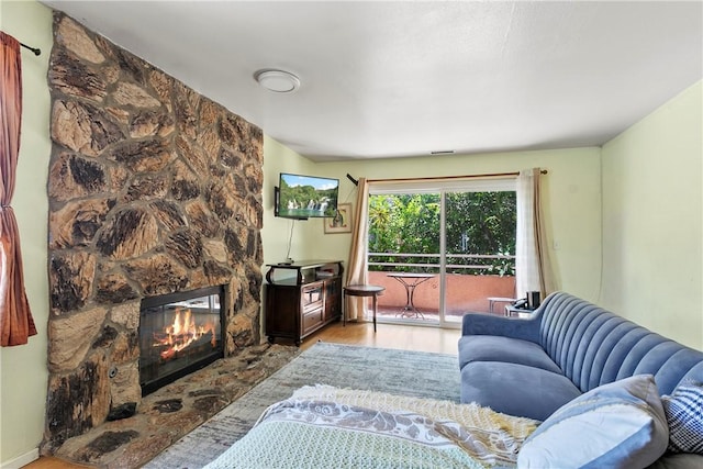 11889 Gale Ave, Hawthorne, CA 90250 - living room with light wood-type flooring and a stone fireplace