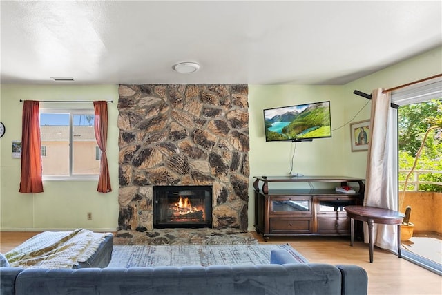 11889 Gale Ave, Hawthorne, CA 90250 - living room with wood finished floors, plenty of natural light, and a fireplace