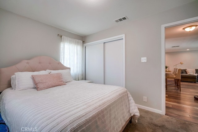 8365 Greenpoint Ave, Riverside, CA 92503 - carpeted bedroom with a closet and baseboards