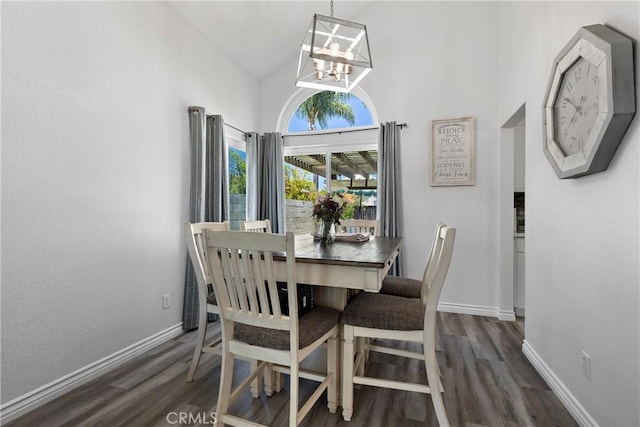39985 Falcon Way, Murrieta, CA 92562 - dining space featuring a chandelier, dark wood-style floors, baseboards, and high vaulted ceiling