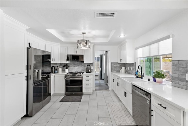 39985 Falcon Way, Murrieta, CA 92562 - kitchen featuring stainless steel appliances, a sink, decorative backsplash, a chandelier, and white cabinetry