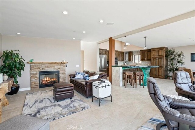 3352 Studio Dr, Cayucos, CA 93430 - living room with a stone fireplace, recessed lighting, and light tile patterned floors