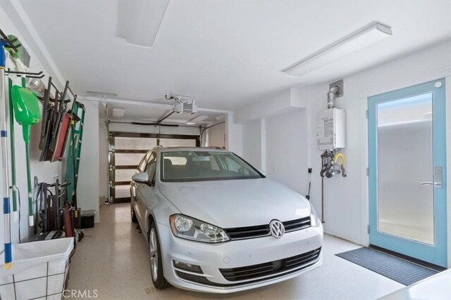 3352 Studio Dr, Cayucos, CA 93430 - garage featuring a garage door opener and water heater