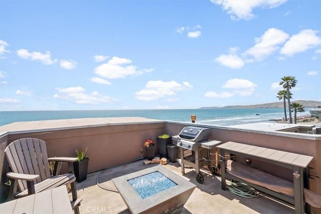 3352 Studio Dr, Cayucos, CA 93430 - view of patio with a fire pit, view of water and beach, and area for grilling