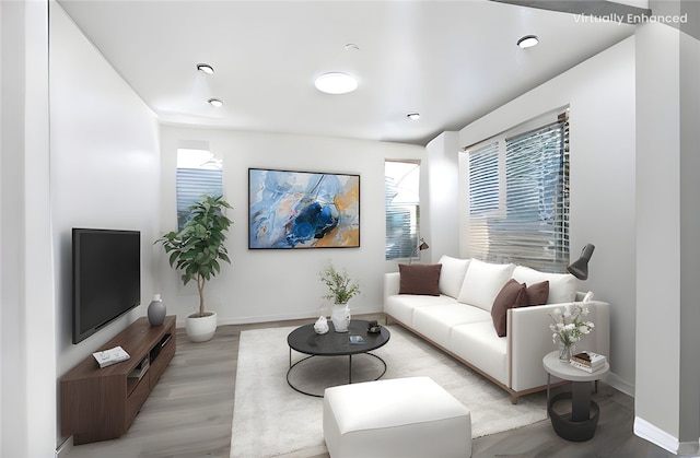 13153 Stanton Dr, Rancho Cucamonga, CA 91739 - living area featuring plenty of natural light, baseboards, and light wood-style flooring